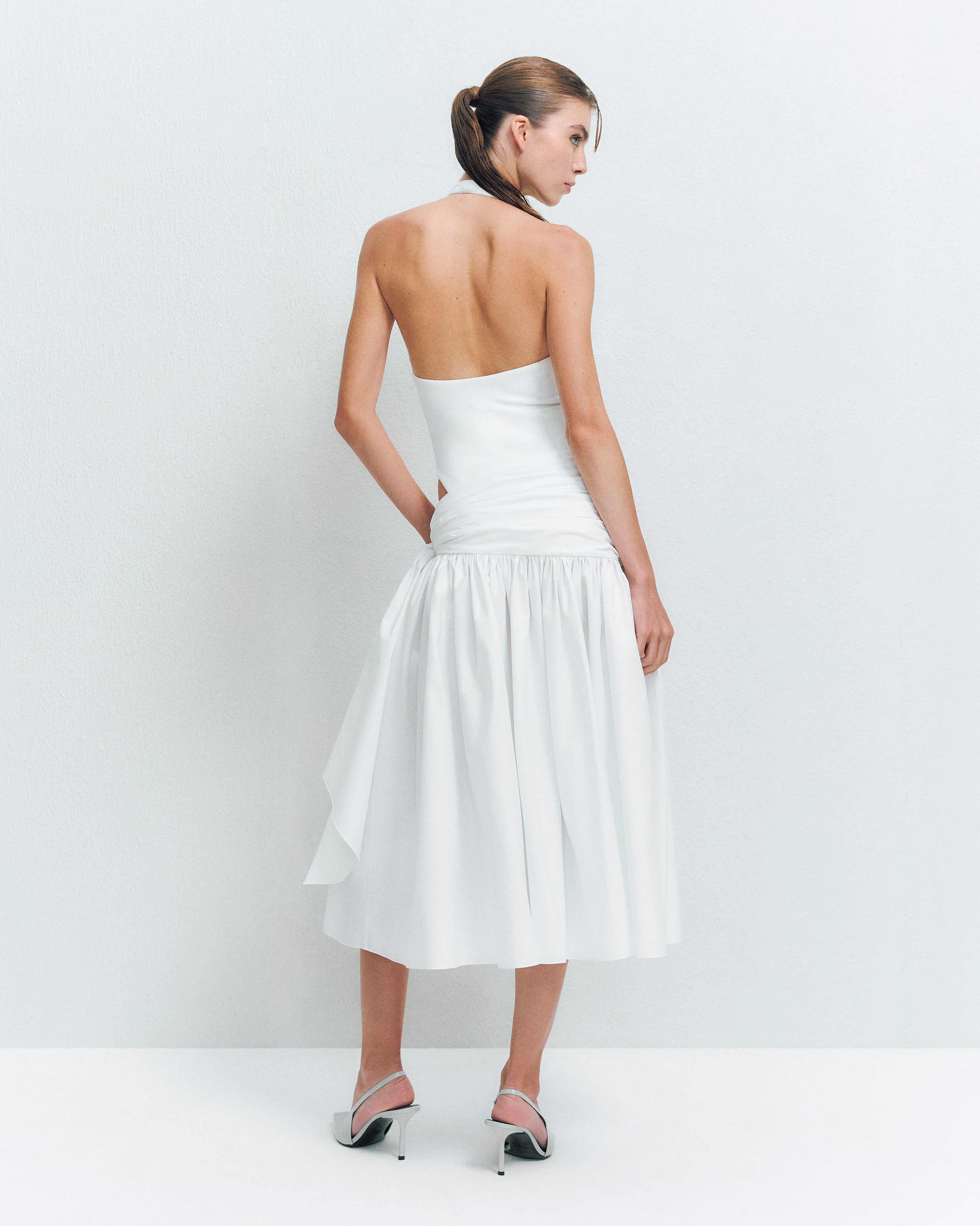 V-NECK PANELED BODYSUIT PAIRED WITH KNOT DETAIL MIDI SKIRT