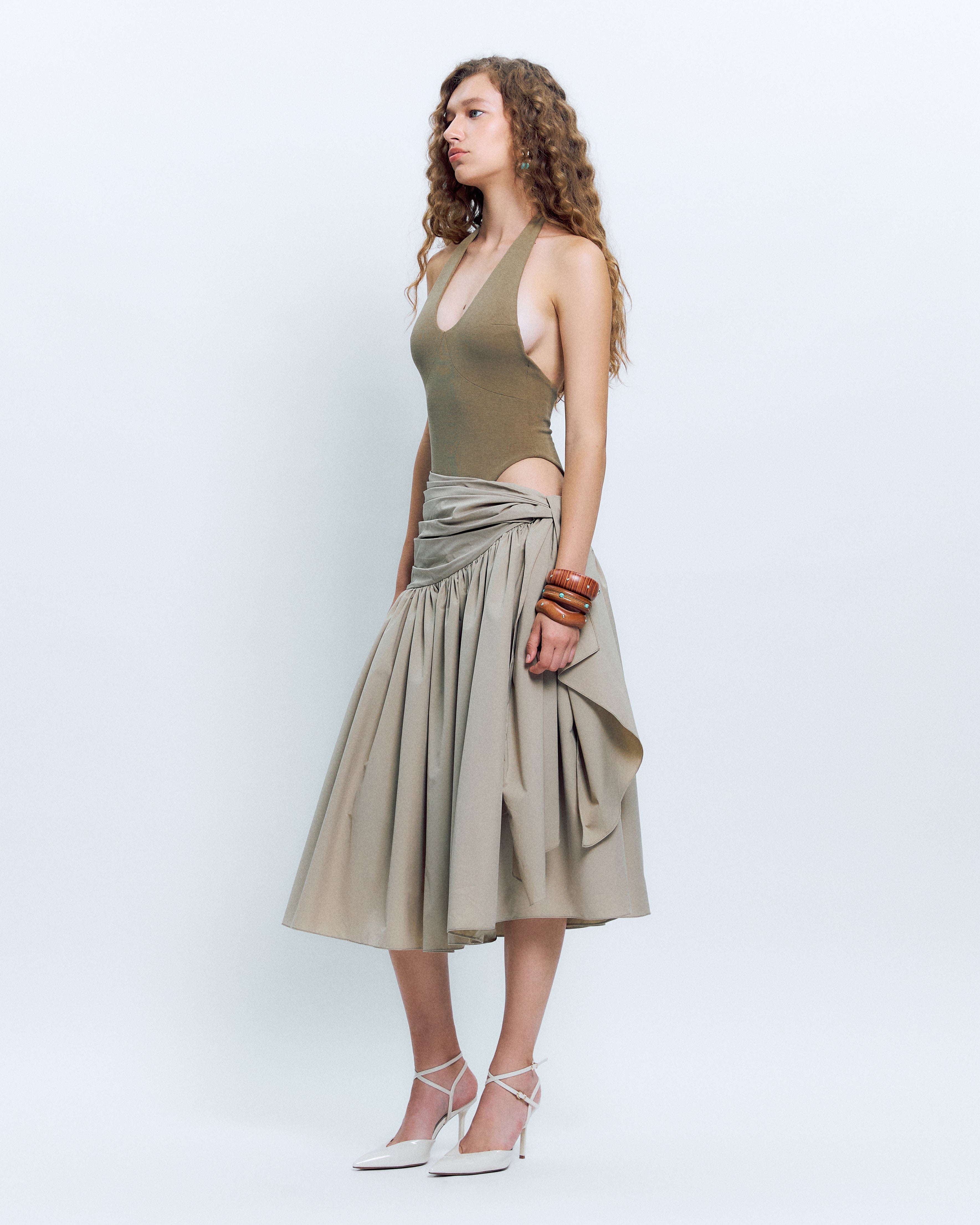 V-NECK PANELED BODYSUIT PAIRED WITH  KNOT DETAIL MIDI SKIRT