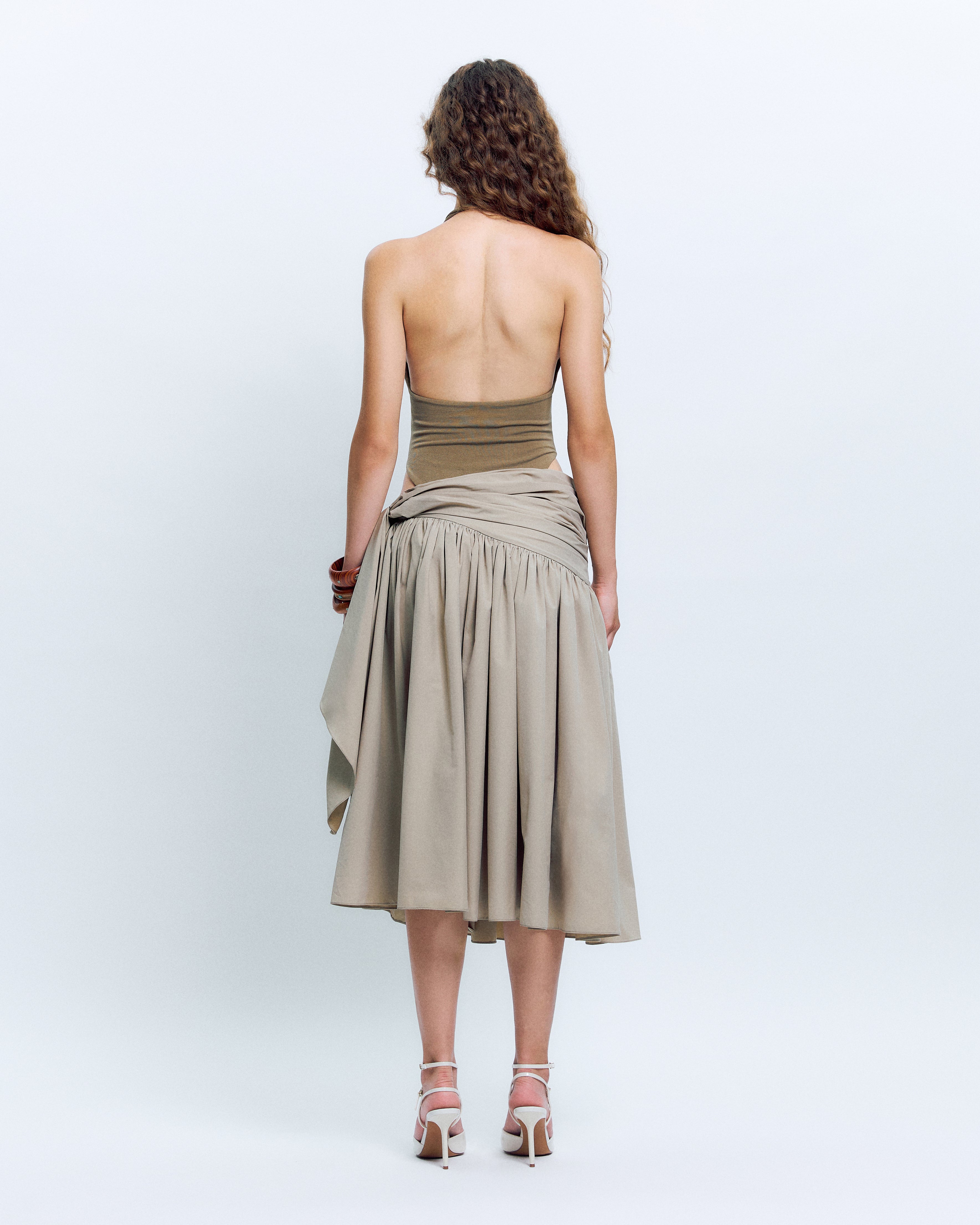 V-NECK PANELED BODYSUIT PAIRED WITH  KNOT DETAIL MIDI SKIRT